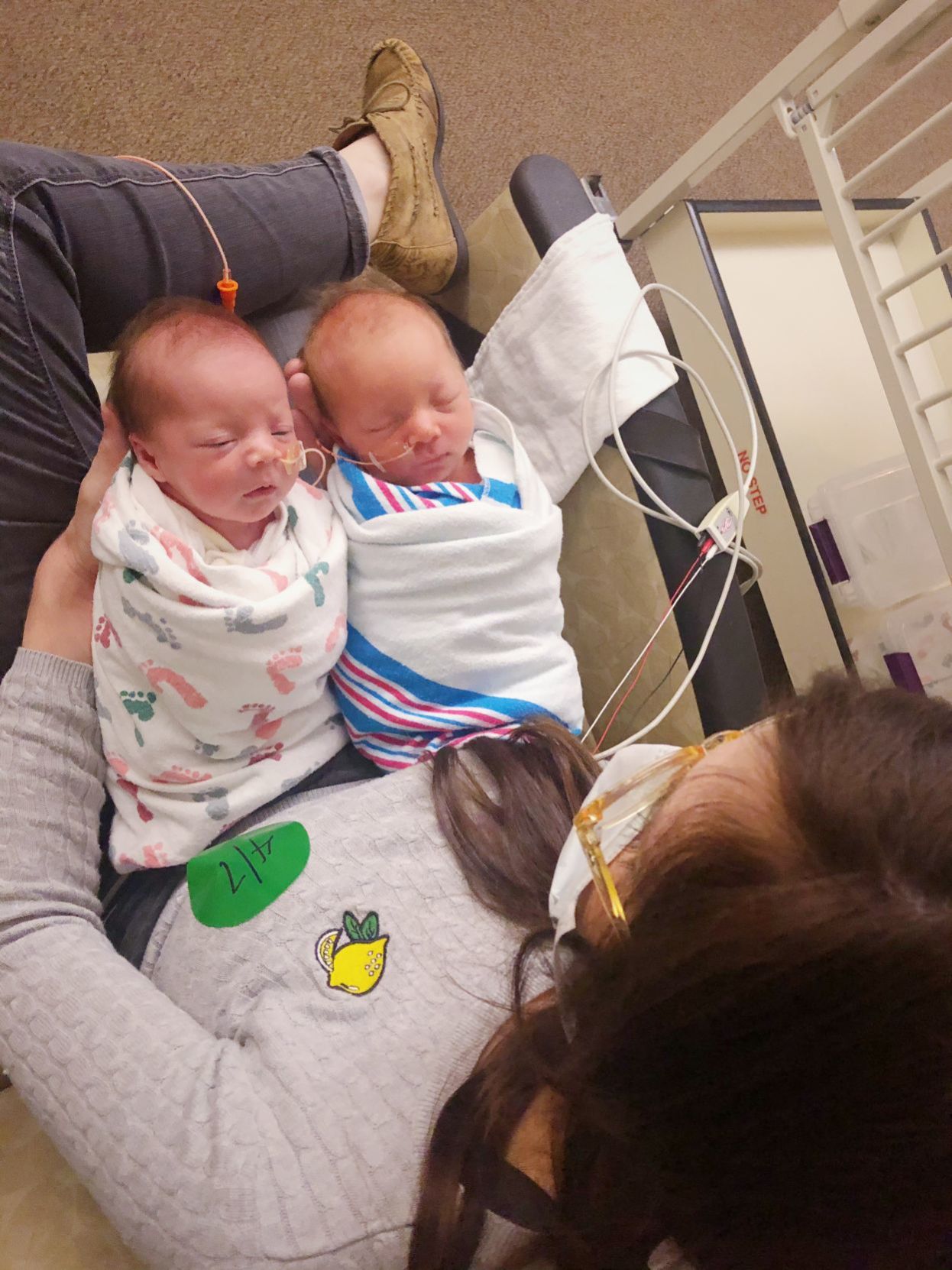 Kelli Bello holding twins